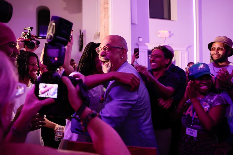 State Rep. Chris Rabb is hugged by his son, Issa Rabb, during his primary election night event at Victorian Banquet Hall Tuesday, May 19, 2026, in Philadelphia.