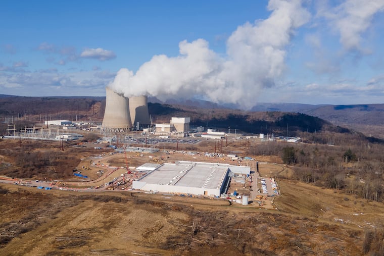 An Amazon data center (front right) is under construction next to the Susquehanna nuclear power plant in Berwick, Pa., in this 2024 file photo. Another Amazon center is being built in Falls Township, Bucks County.