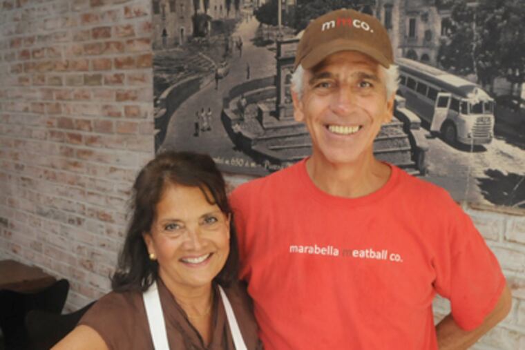 Gabe Marabella, with wife Judy, and Lisa Wilson, (not pictured), had adjacent food-fair booths. (Clem Murray / Staff Photographer)