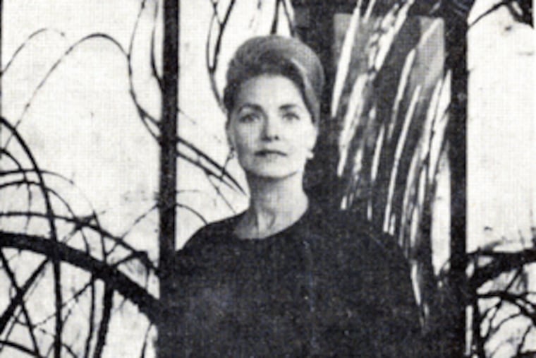 Shirley Tattersfield stands in front of a mural she constructedfor the Travelers Insurance Cos.' pavilion at the 1964 World's Fair. The huge glass creation represented Earth's beginnings.