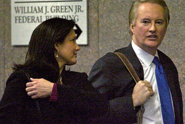 Former CBS3 anchor Larry Mendte and his wife, Fox 29 anchor Dawn Stensland, leave the Byrne Federal Courthouse after Mendte was sentenced. (John Costello/Staff Photographer)