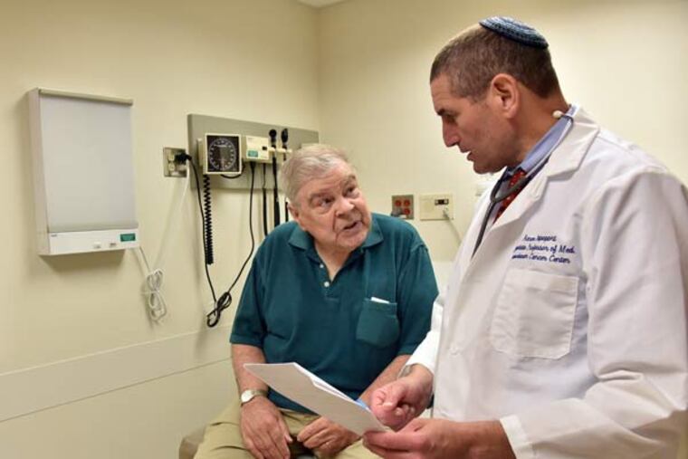 Martin Melley, 76, Linthicum, talks with Dr. Aaron Rapoport after receiving test results at the University of Maryland Medical Center on Aug. 5, 2015 in Baltimore, Md. Melley has received treatment for multiple myeloma for 13 years and is part of a clinical trial Rapoport is conducting. Melley's T cells were genetically engineered in 2012 to treat the cancer. (Kim Hairston/Baltimore Sun/TNS)