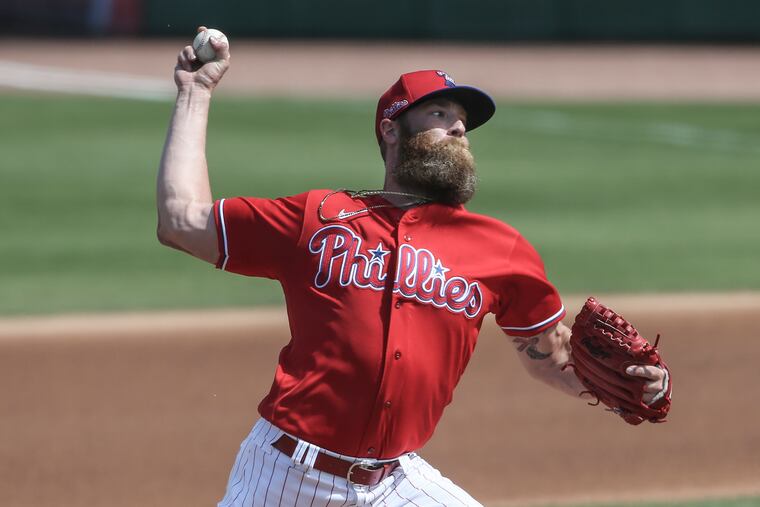 Archie Bradley throws against the Pirates in Clearwater, Fla.