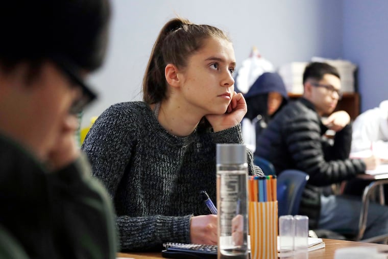 Senior Hazel Ostrowski attends a first-period statistics class at Franklin High School in Seattle last year, where researchers found that later school start times meant students got more sleep and grades improved. Hazel was among study participants who wore activity monitors for the study. (AP Photo/Elaine Thompson)