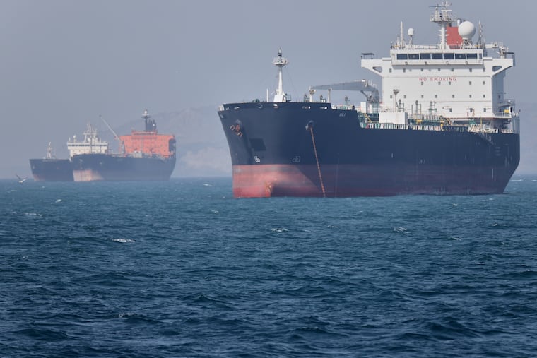 Oil tankers sit at anchor offshore in the Strait of Hormuz off Bandar Abbas, Iran, Saturday, May 2, 2026.