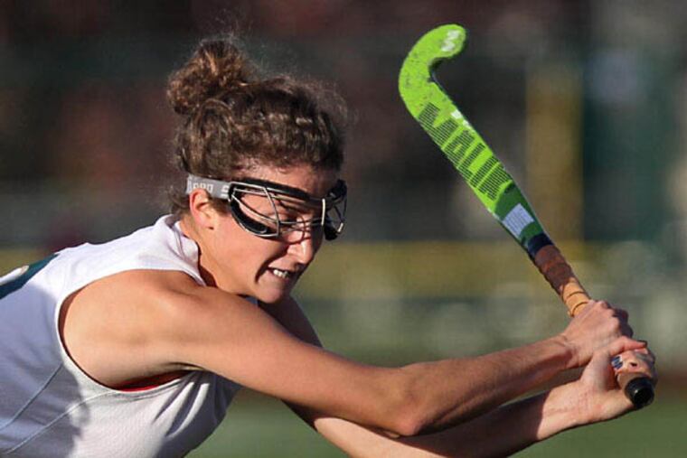 Camden Catholic's Tara Vittese takes a swing at the ball during the first half against Red Bank Catholic. ( DAVID M WARREN / Staff Photographer )