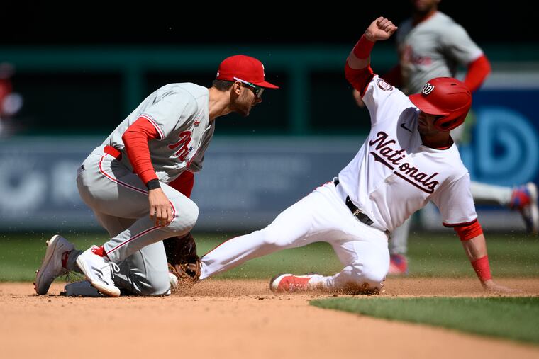 Washington's Lane Thomas is safe stealing second base against Phillies shortstop Trea Turner. The Nationals stole five bases on Sunday.