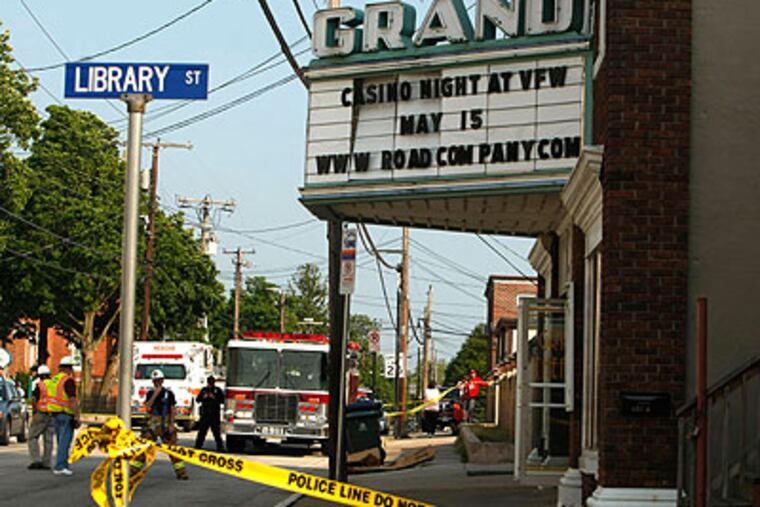 There was no visible damage to the front of the Grand Theater in Williamstown, N.J., on Friday, but the roof collapsed in the back of the building. (Ron Cortes / Staff Photographer)