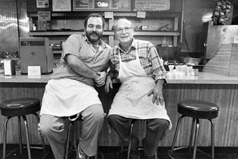 Domenic C. Spataro (right) and son Domenic M. at their deli counter in Reading Terminal Market in 1986.