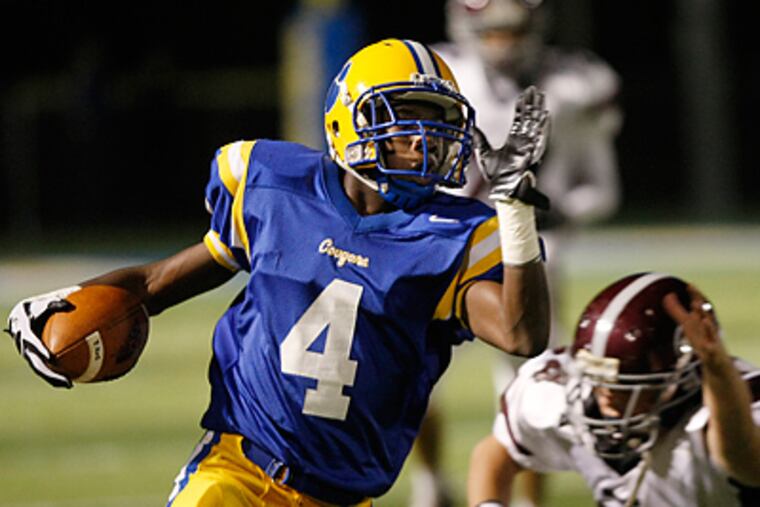 Downingtown East's Jay Harris returns a punt for 54 yards to set up a field goal. (Michael S. Wirtz / Staff Photographer)