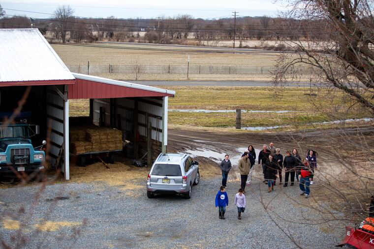 The Jones ancestors walk across the driveway at the Linside farm in Lumberton. The farm has been in the family's history since their ancestors immigrated around the American Revolution and is now full of the family's historic keepsakes.