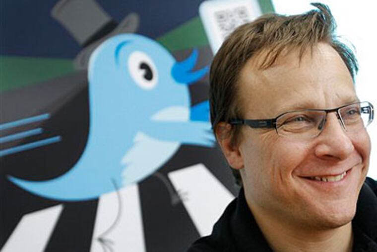 Twitter Inc. spokesman Sean Garrett smiles in an interview with the Associated Press during his visit to Tokyo. Garrett's company is hiring a Washington D.C. representative to promote Twitter's use in politics and hopes to expand that worldwide, he said. Allowing jurors to check Facebook messages is a stretch, but state courts could permit more 21st century communication. (AP Photo / Itsuo Inouye)