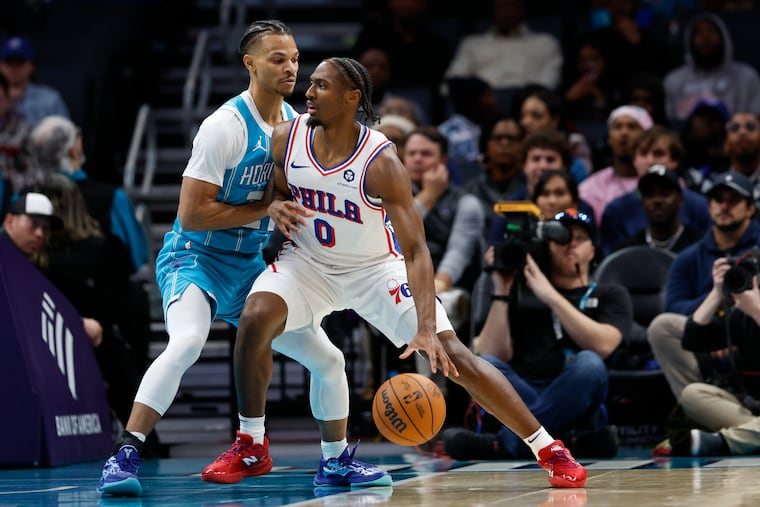 Sixers guard Tyrese Maxey is guarded by Isaiah Wong. Maxey scored a game-high 40 points against the Hornets.