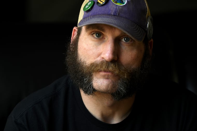 Joe Shearer, who was diagnosed with traumatic brain injuries from fighting in Iraq, poses for a portrait in his home in Colorado Springs, Colo., Wednesday, Aug. 5, 2026.