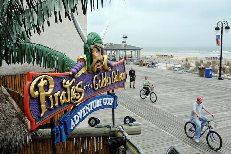 The pirate beckons boardwalk strollers into the Pirates of the Golden Galleon adventure golf course along the Ocean City boardwalk near 11th St. May 15, 2014. The outlaw pirate theme runs throughout Ocean City attractions from miniature golf, amusement rides and even a boat cruise.