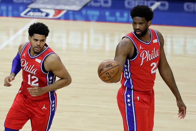 Sixers center Joel Embiid (right) and forward Tobias Harris are in the midst an easy homestretch.