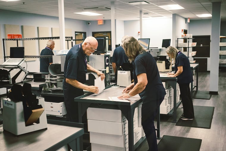 Mail-in ballots are processed by officials at the Pinellas County Supervisor of Elections Office on primary election day in Largo, Fla., Aug. 18, 2026. The rate at which mail-in votes are rejected for being late has risen in the last two cycles.
