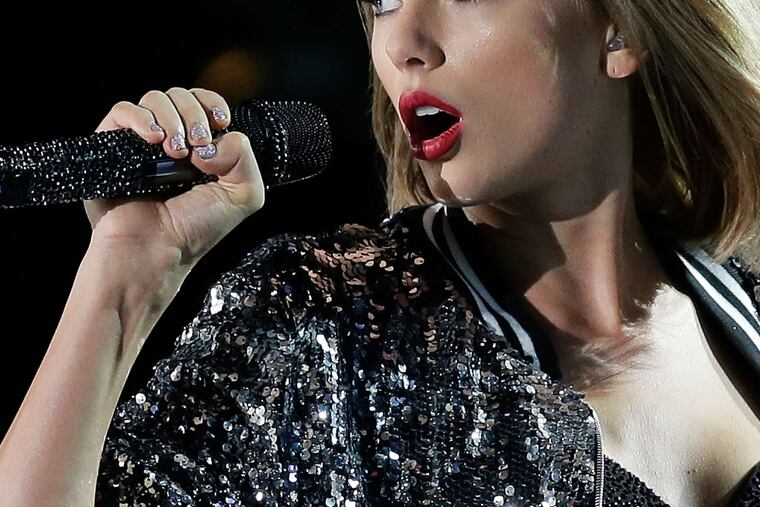 Taylor Swift tied for seven Grammy nominations . . .