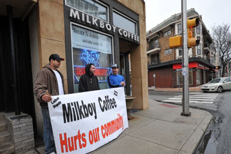 At MilkBoy Coffee in Ardmore, Local 8 Carpenters Union members Greg Scirrotto (left), Bill Strassheim and Mike Mehalchick are protesting because the cafe's owners are using non-union workers at their new site in Center City. (Sharon Gekoski-Kimmel / Staff Photographer)