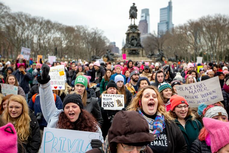Bridget Fitzpatrick (left), a student at Pace cheers alongside her friend, Emma McCoy, a student at Jefferson at the Art Museum steps during the women's march in Philadelphia, January 19, 2019. Fitzpatrick came to Philadelphia for the march.