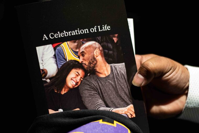 Books and shirts are given to family, friends, and fans entering Staples Center before the beginning of the Celebration of Life for Kobe and Gianna Bryant event inside Staples Center on Monday, Feb. 24th, 2020.