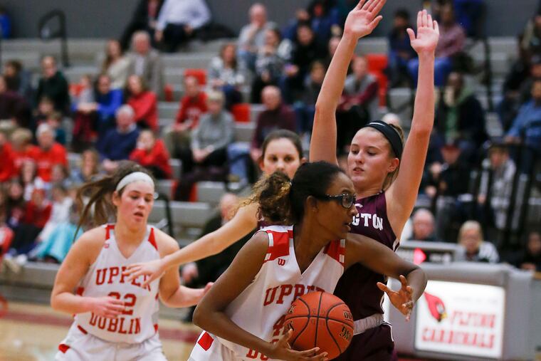 Upper Dublin's Jackie Vargas drives to the basket against Abington's Camryn Lexow in a game in January.