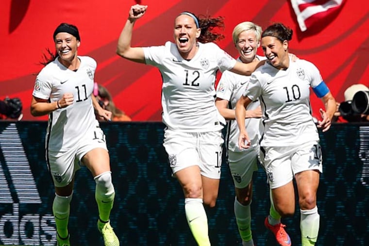 United States midfielder Carli Lloyd (10) celebrates with teammates after scoring against Japan during the first half of the final of the FIFA 2015 Women's World Cup at BC Place Stadium. (Michael Chow/USA Today)
