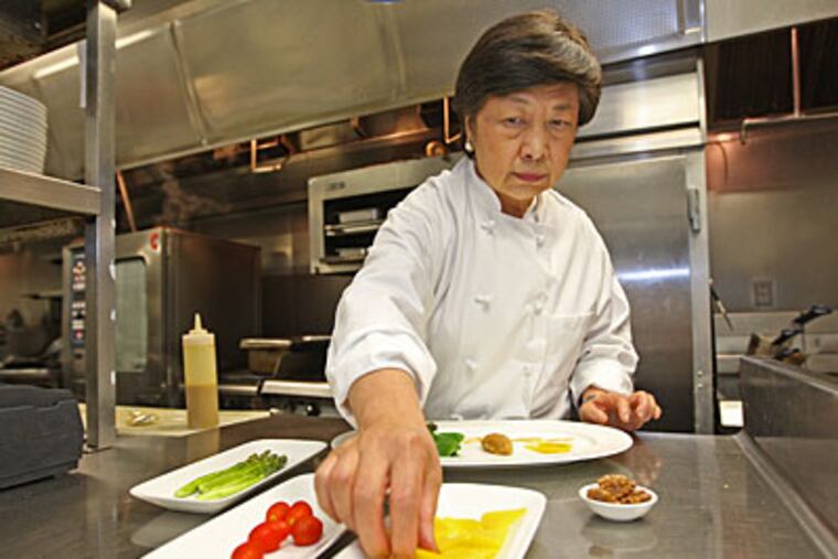 Susanna Foo prepares wontons in the kitchen on Walnut Street. Her culinary career took off after she met the retired president of the Culinary Institute of America while helping her family run a restaurant called Hu-Nan in Wayne. (MICHAEL BRYANT / Staff Photographer)