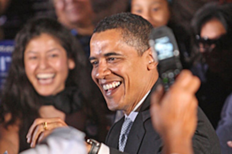 Barack Obama is all smiles as he speaks to the crowd gathered on Independence Mall for a campaign rally on Friday night in Old City.