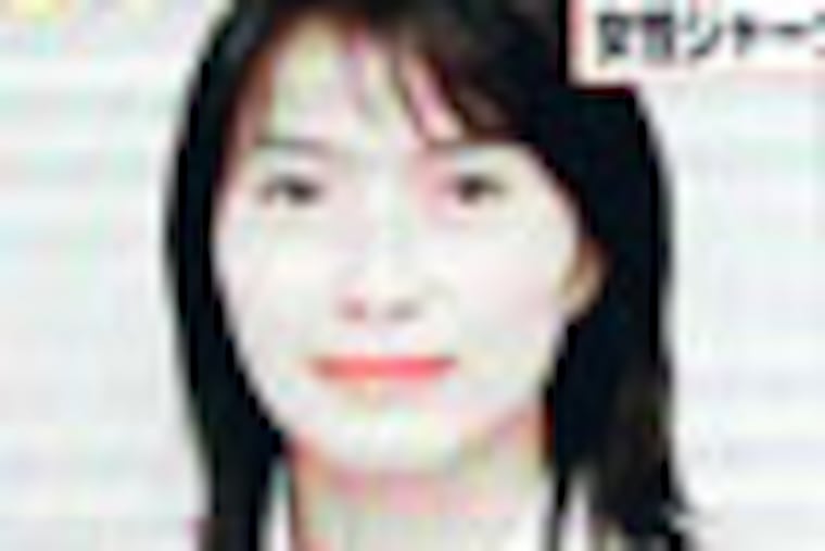 A portrait of Japanese journalist Mika Yamamoto is shown on a large monitor screen in Tokyo Tuesday, Aug. 21, 2012 during a TV news broadcast reporting her death in Syria. Yamamoto, a veteran war correspondent with The Japan Press, an independent TV news provider that specializes in conflict zone coverage, was killed Monday in the northwestern city of Aleppo, said Masaru Sato, a spokesman with the Foreign Ministry in Tokyo. (AP Photo/Itsuo Inouye)