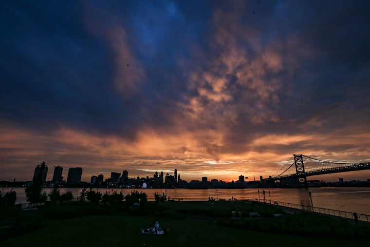 The summer solstice sun sets on Philadelphia as seen from the Camden waterfront in 2022. This year it occurs at 4:24 a.m. on Sunday.