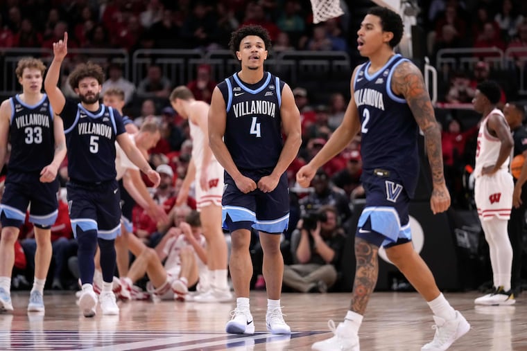 Villanova guard Tyler Perkins (4) reacts to a basket scored by Villanova guard Bryce Lindsay (2) during overtime against Wisconsin on Friday.