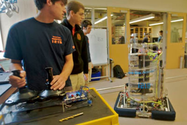 Jack Anthony handles the controller for Taz, who placed in the FIRST competition. (FIRST stands for "For Inspiration and Recognition of Science and Technology") "Lunacy" competition. There were 1677 teams from 43 regions in competition. The 120 lb. robots collected "moonrocks" on a slick "lunar surface." (John Costello / Staff Photographer)