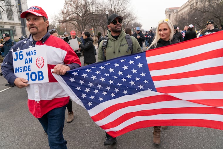Enrique Tarrio (center), the former head of the Proud Boys, marches on Constitution Avenue toward the U.S. Capitol after a rally on the fifth anniversary of the Jan. 6 riot in Washington.
