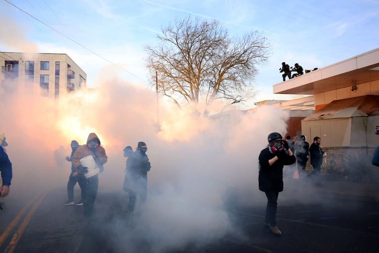 Federal agents lobbed tear gas and flash bangs at protesters in front of the ICE building on Jan. 31, 2026, in Portland, Ore.