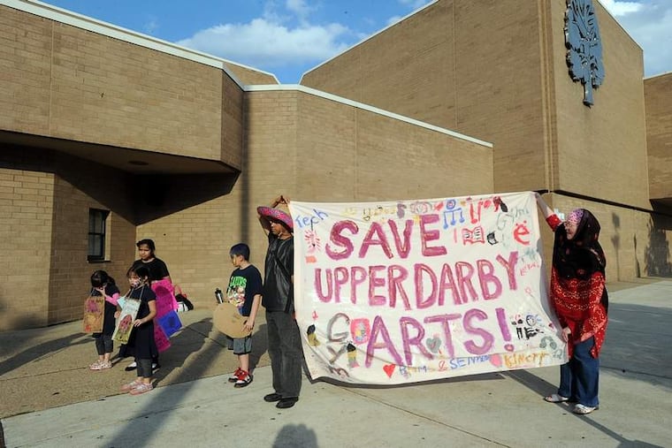 Parents and others protest proposed cuts to arts and music programs outside Upper Darby High School before a school board meeting. SHARON GEKOSKI-KIMMEL / Staff Photographer