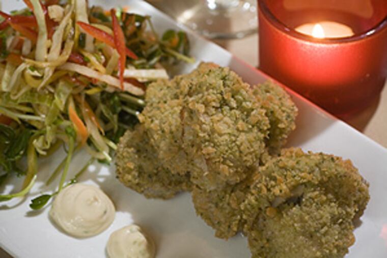 Fried oysters with fiery slaw, as served at Chesham Cottage. Readers of a recent review wondered how positive remarks about the Mount Airy restaurant translated into only a single bell in Craig LaBan's rating system.