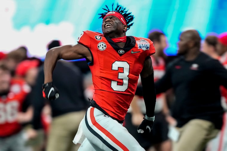 Georgia running back Andrew Paul (3) celebrates the Bulldogs' comeback win over Ohio State in the Peach Bowl.