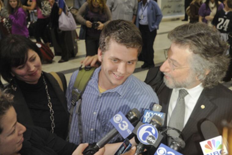 Greg Porter, the 19-year-old Drexel University student who was arrested in Egypt during protests is greeted at Philadelphia International airport by his mother Nancy Porter and Attorney Theodore Simon. (Ron Tarver / Staff Photographer)