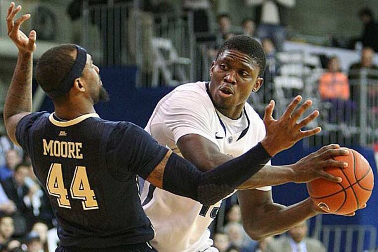 Mouphtaou Yarou squares off with Pitttsburgh's J.J. Moore during the second half at The Pavilion in Villanova, Pa., Wednesday, January 16, 2013. (Steven M. Falk/Staff Photographer)