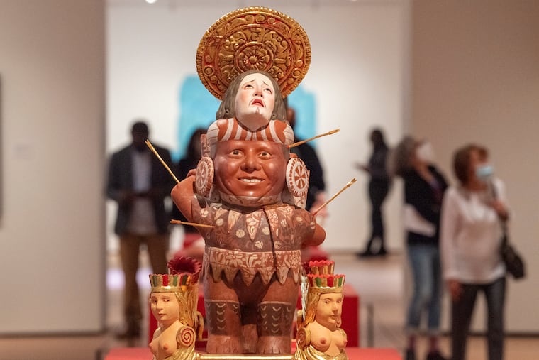 Museum visitors walk near the art of Kukuli Velarde in the new contemporary galleries at the redesigned Philadelphia Museum of Art