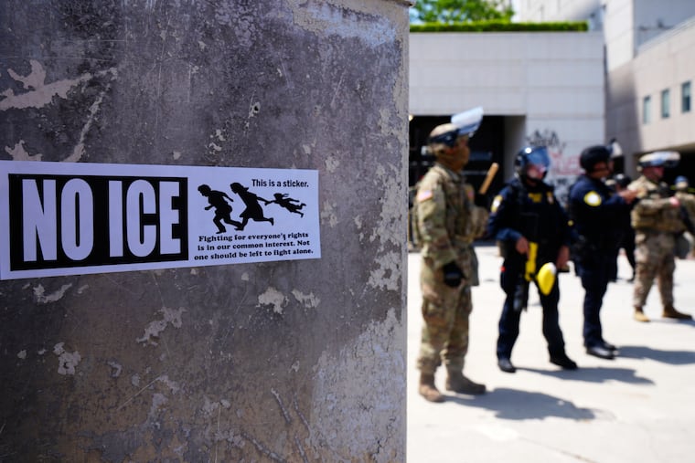 DHS police and National Guard protect the outside of the Metropolitan Detention Center, Wednesday, June 11, 2025, in Los Angeles.