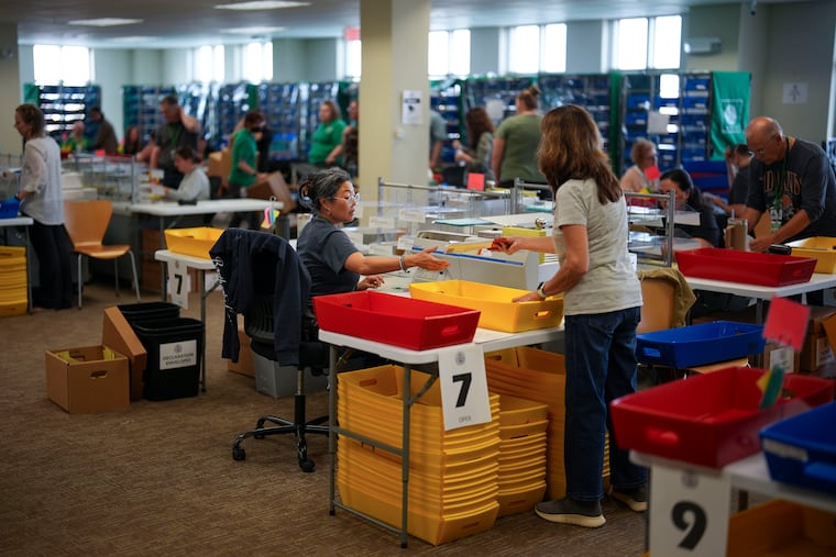 Election workers process mail ballots for the 2024 General Election at the Chester County, Pa., administrative offices, Tuesday, Nov. 5, 2024, in West Chester, Pa.