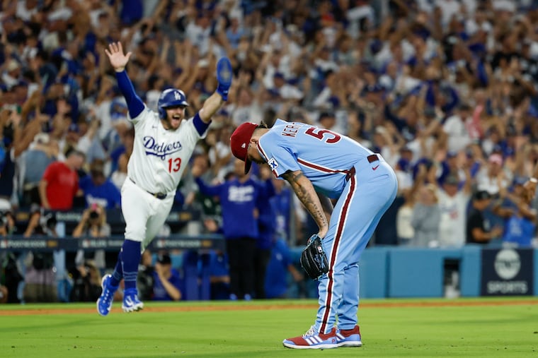 The Dodgers' Max Muncy celebrates as Phillies pitcher Orion Kerkering reacts to his errant throw home that scored the winning run in the 11th inning of Game 4.