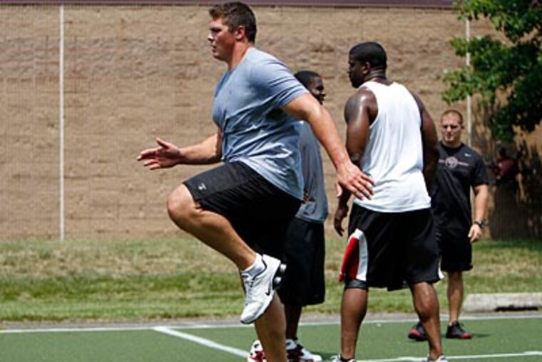 Eagles' top draft pick Danny Watkins works out with teammates on Thursday. (David Maialetti/Staff Photographer)