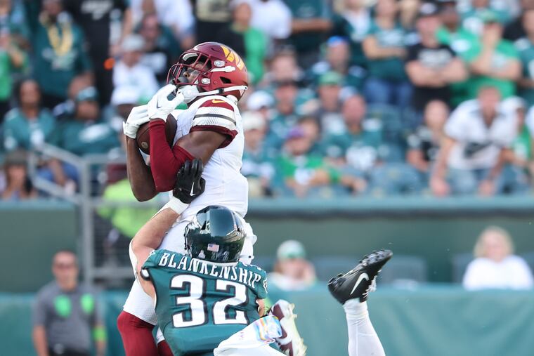 Eagles safety Reed Blankenship defends Washington Commanders wide receiver Terry McLaurin for a incomplete pass in overtime on Sunday.