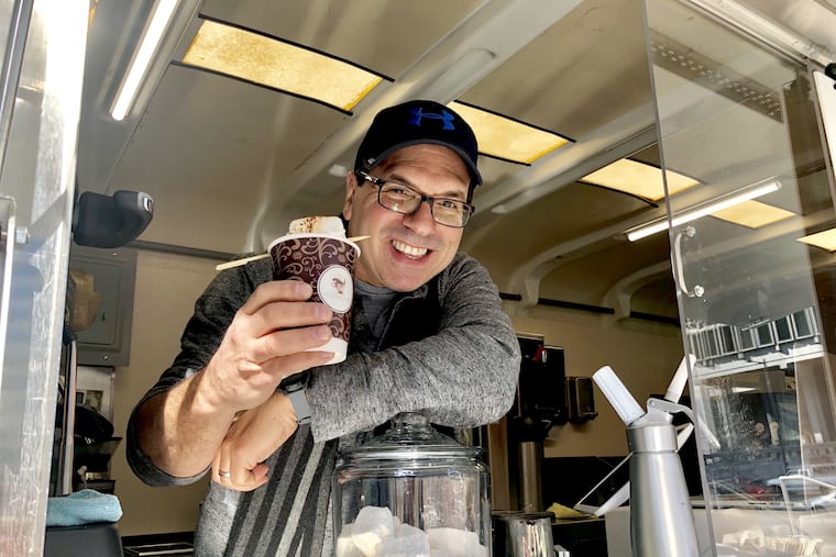David Truskinoff of La Chocolatera, a food truck specializing in hot chocolate, parked outside LOVE Park.
