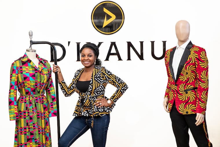 Addie Elabor, with an African print dress for women and a Kasim African print blazer, right, for men.