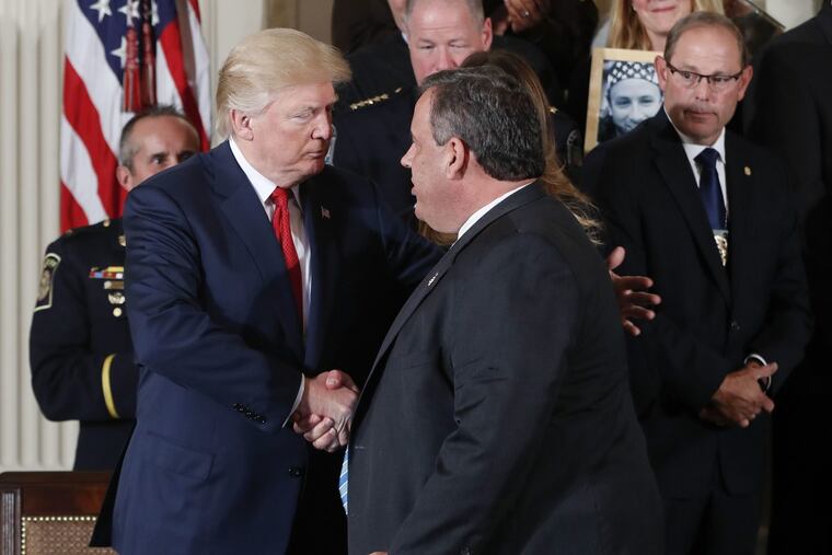 President Trump shakes hands with Gov. Christie after signing a presidential memorandum to declare the opioid crisis a national public health emergency.