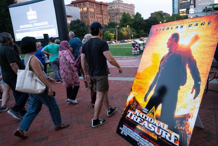 People gather on Independence Mall for an outdoor screening of the 2004 film “National Treasure” in Philadelphia on Friday as part of the city's first "National Treasure" weekend.